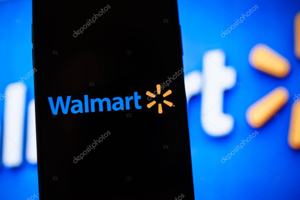 Walmart logo on the smartphone screen. High quality photo.