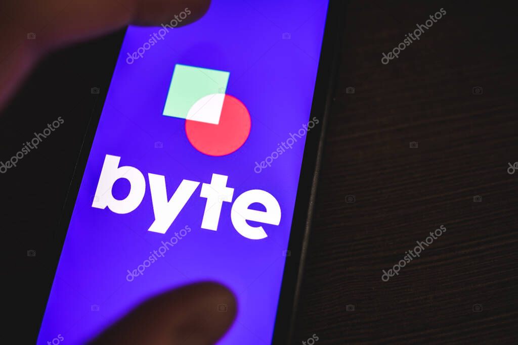 Byte logo on the smartphone screen. High quality photo.