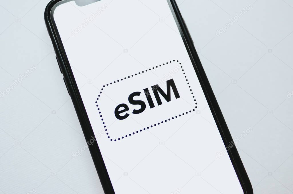 eSIM card chip logo on the smartphone screen. 