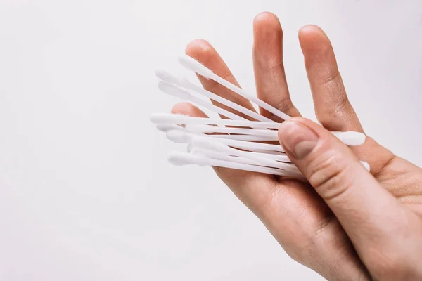 White cotton buds in a female hand isolated. — Stock Photo, Image