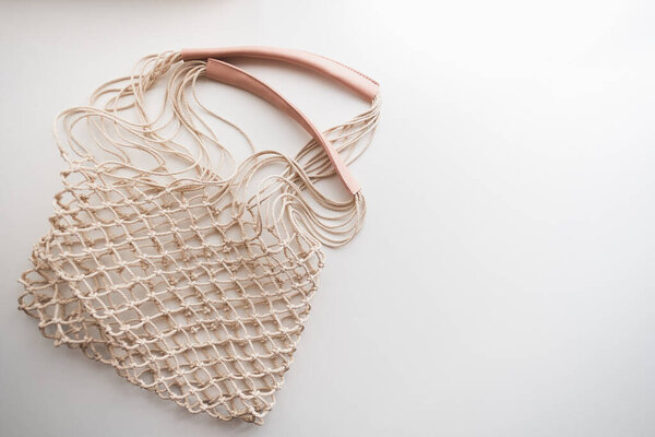 Zero waste eco net bag on white background, copy space. . High quality photo