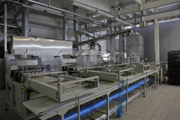 Industrial equipment and machinery at the factory of bread and sweets