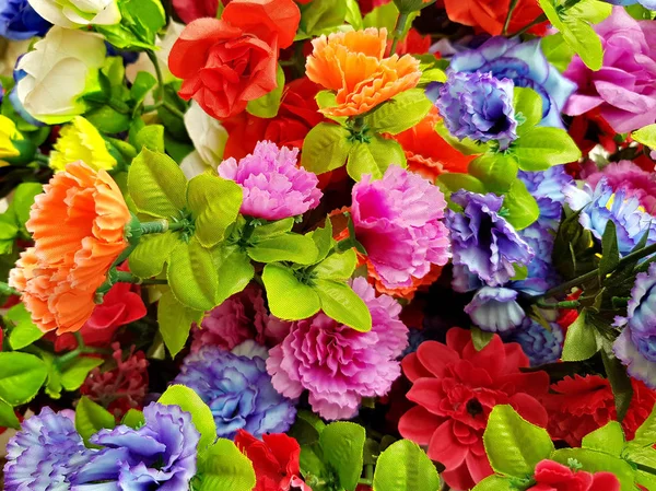 Fake plastic bright flower blooming — Stock Photo, Image