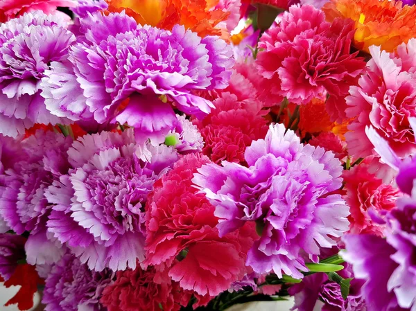 Fake plastic bright flower blooming — Stock Photo, Image