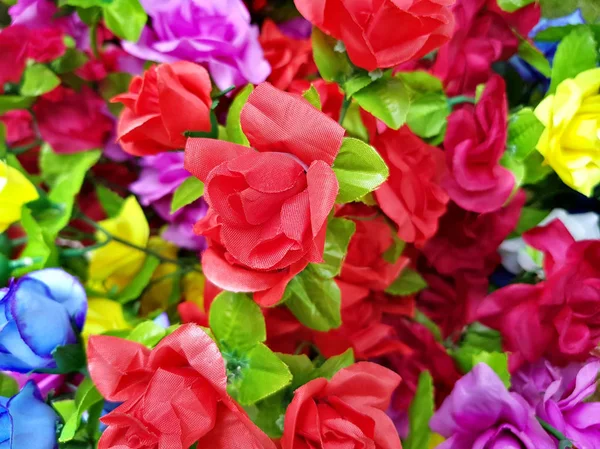 Fake plastic bright flower blooming — Stock Photo, Image