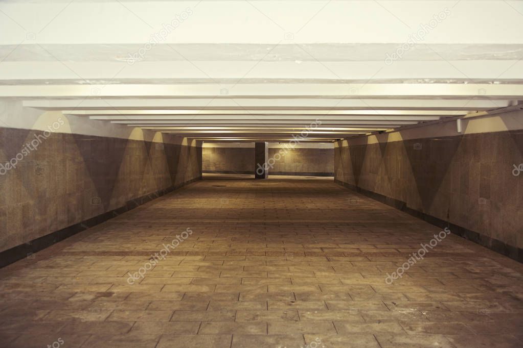 Long gray underground pedestrian passage