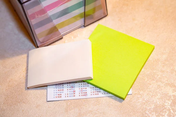 Multi-colored blocks of note sheets for office and home use