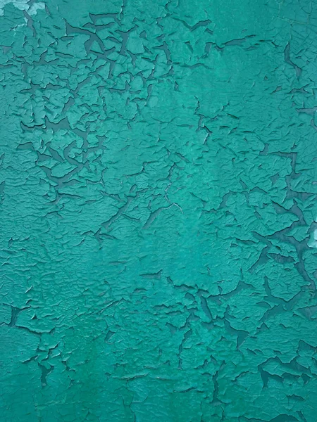 abstract texture turquoise background with cracks and craquelure.