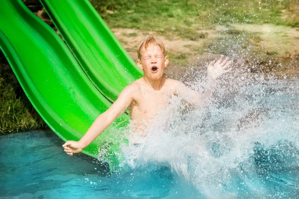 Young Boy Kid Has Fun Splashing Lake Going Water Slide Stock Photo