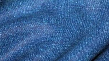 Canlı Denim mavisi. Kumaş dalgalarının arkaplan hareketi. 