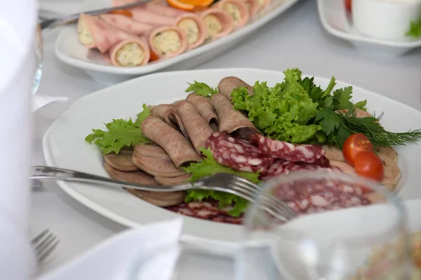 Cold dishes and snacks on the festive table. — Stock Photo, Image