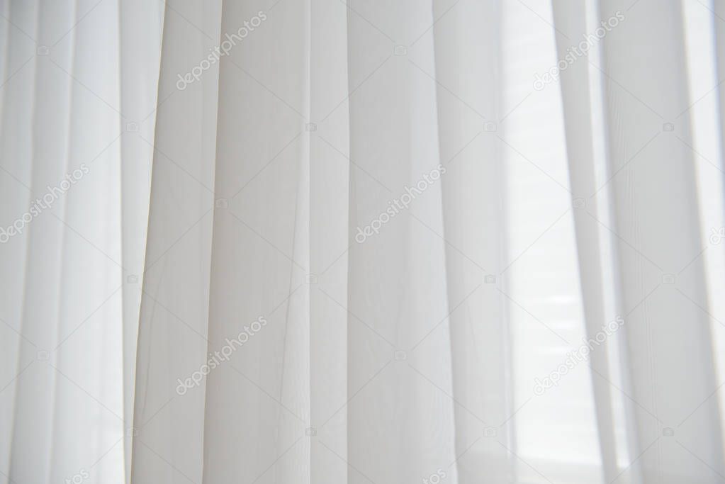 Background of the white cloth curtains on the window.