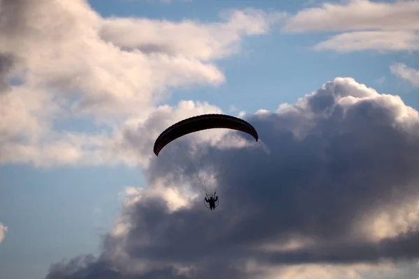 Paraglider flies in stormy skies. The glider is a light aircraft plans in the air.