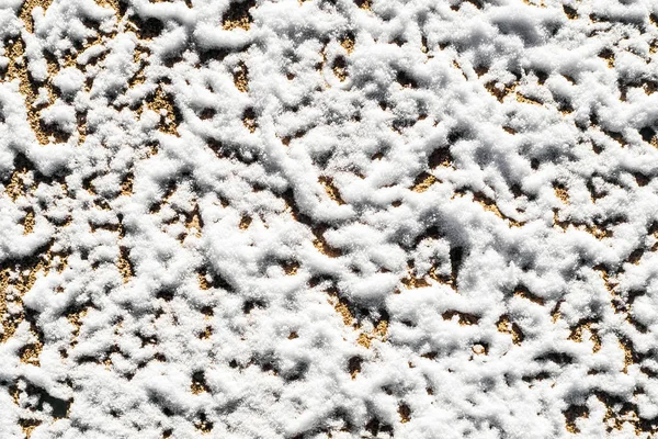 The texture is a print of the tire on icy dirt road. — Stock Photo, Image