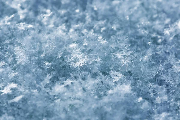 Achtergrond van korrelige abstracte blauwe sneeuw. — Stockfoto