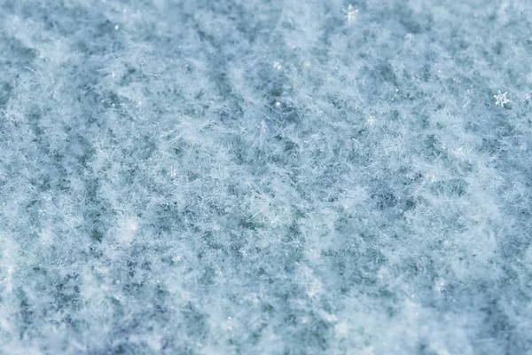 Achtergrond van korrelige abstracte blauwe sneeuw. — Stockfoto