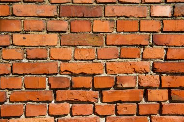 Eski bir kırmızı tuğla duvarın arka planı. Antik tarihi binaların yıkımı ve korunması.