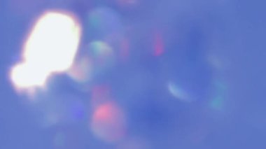 Bokeh mavisi sızıntı yapıyor. Çemberler hareket halinde bulanık.