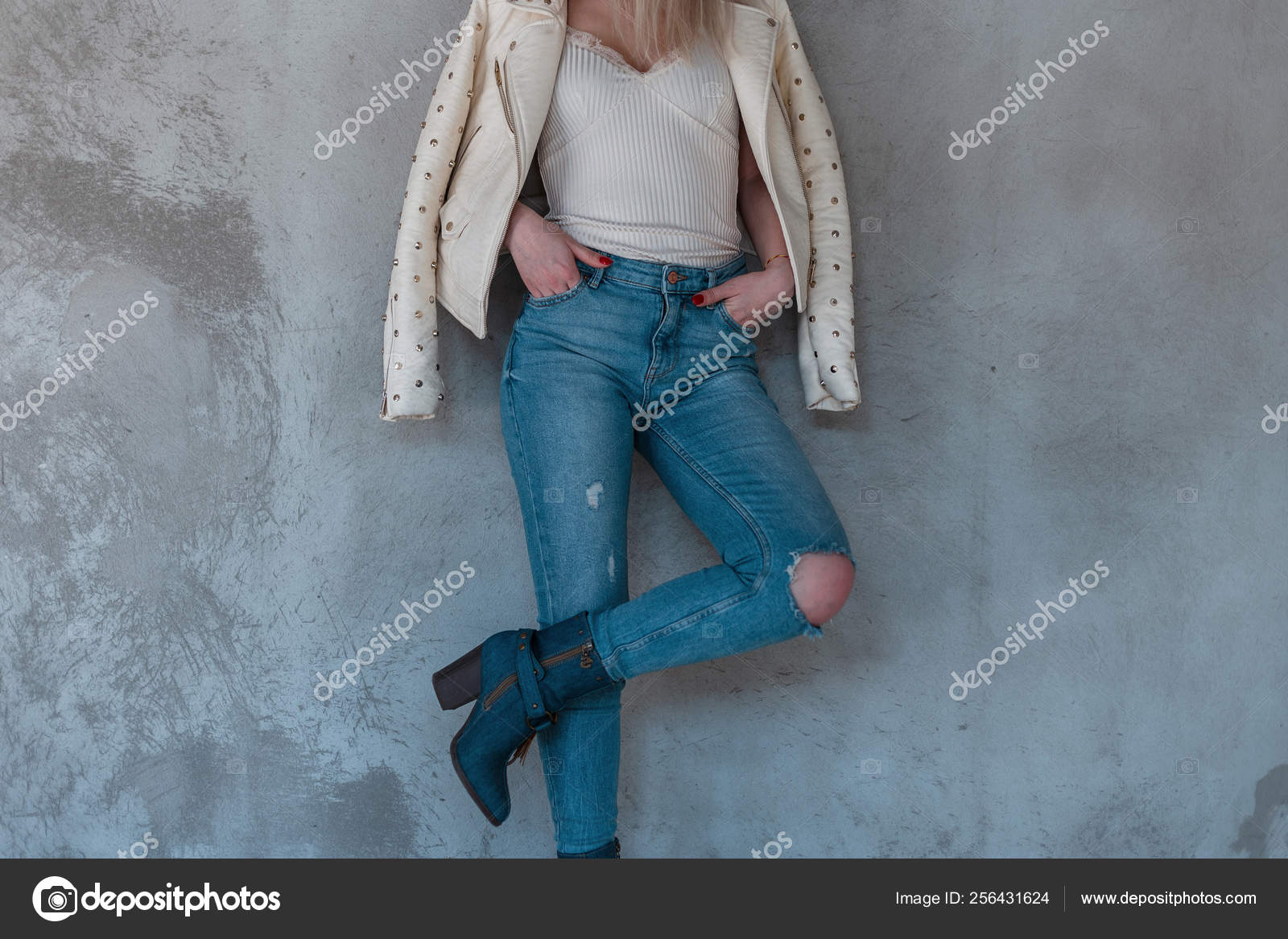 ripped jeans and cowboy boots