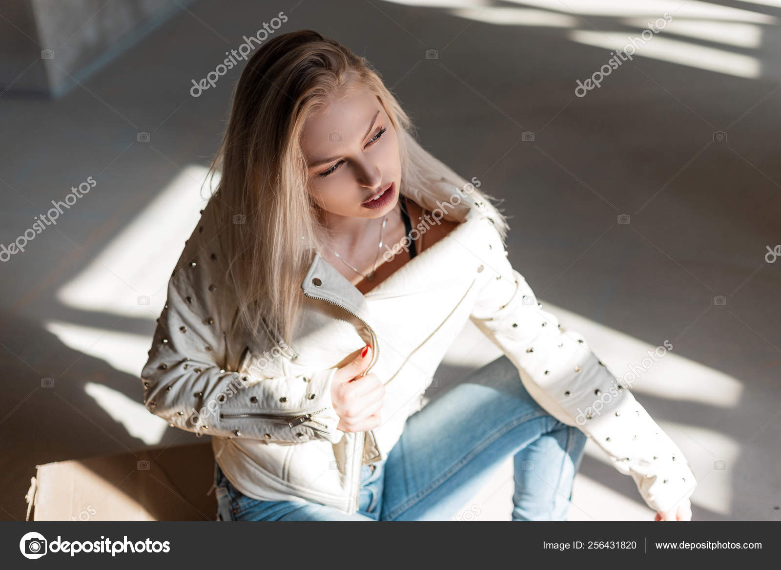 ripped jeans and cowboy boots