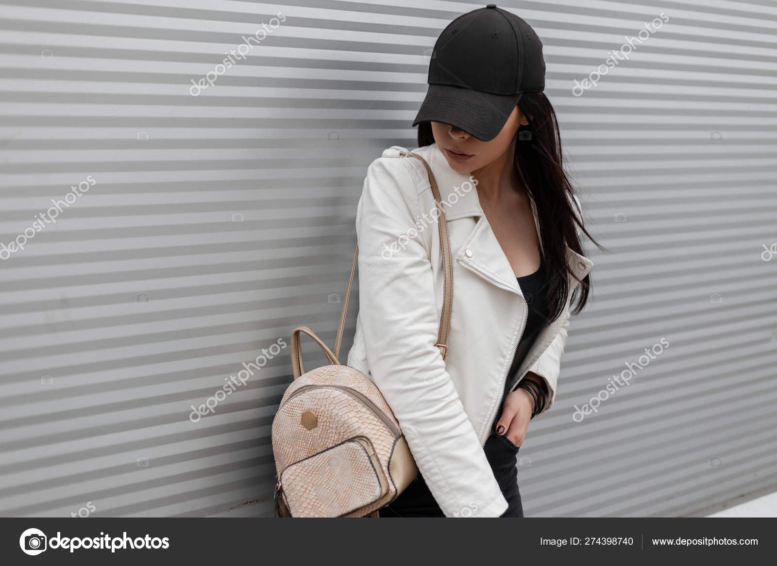 leather jacket and baseball cap