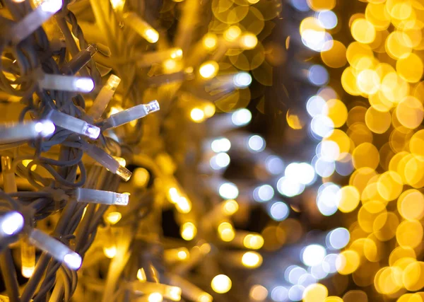 garland with led lights and bokeh. concept of lamps or lantern hanging on the evening street or happy holiday mood