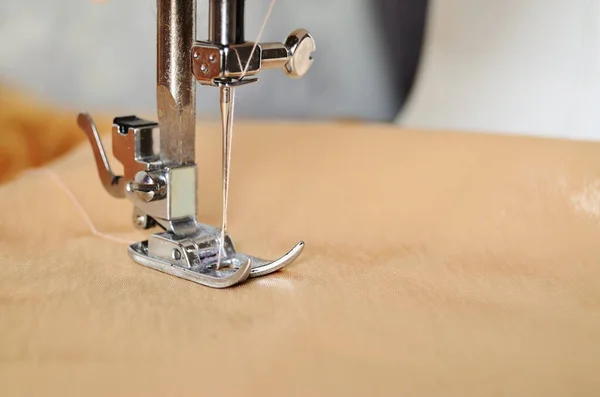 sewing machine close-up needle raised horizontal orientation