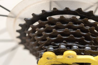 Bicycle gears and rear derailleur.The bike chain is dirty after riding clipart