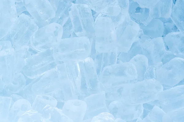 Ice cubes background.High angle view of heap of man made ice