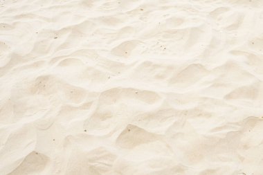 Sahilde arka plan olarak kum, yaz arka planında güzel kumsal.