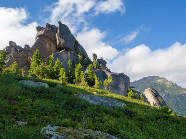 The sun illuminates the bizarre stones in the Ergaki nature park. Siberian wildlife