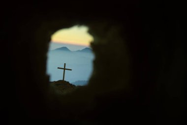 Empty tomb with cross symbol for Jesus Christ is risen clipart
