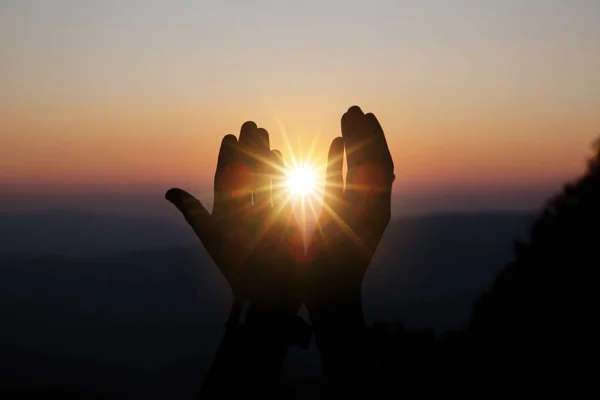 Faith of christian concept: Spiritual prayer hands over sun shin — Stock Photo, Image