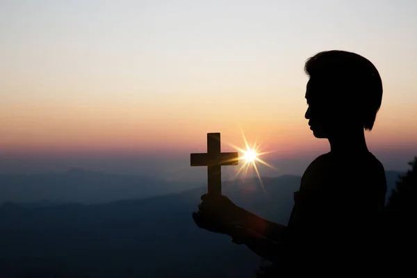 Faith of christian concept: Spiritual prayer hands over sun shin