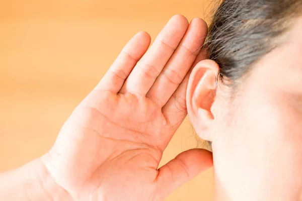 Female suffering from deafness, trying hard to hear something. — Stock Photo, Image