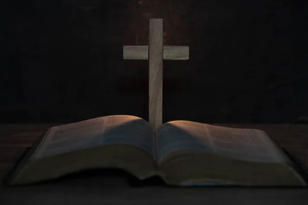 Cross and holy Bible on wooden table — Stock Photo, Image