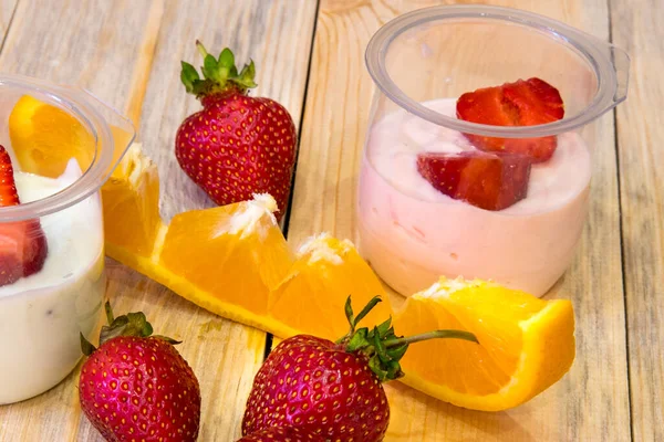 Sliced Strawberries Half Jars Yogurt Wooden Table — Stock Photo, Image