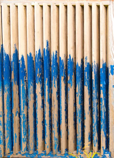 Old wooden backdrop with shabby blue paint, background