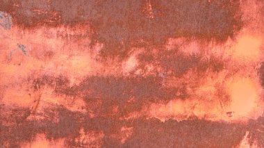 Paslı ve kırmızı boyalı eski bir metal levha.