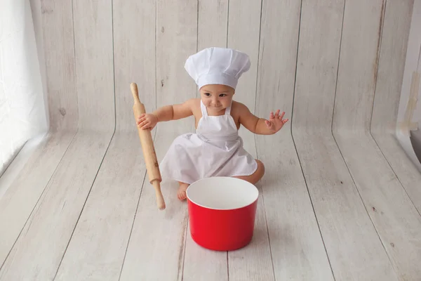 Little baby chef in apron. — Stock Photo, Image