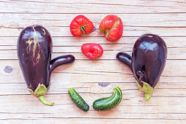 Home grown vegetables, ugly food, flat lay, wooden background, copy space