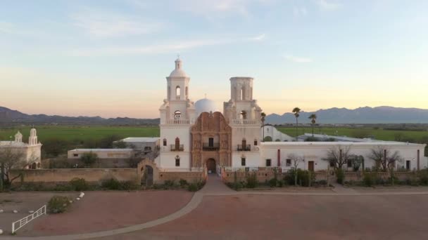 Historic Mission San Xavier del Bac in Tucson, Arizona at sunrise, drone shot — Stock video