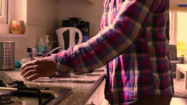 A persons daily routine, manually grinding fresh coffee beans, close-up 15 seconds video. 