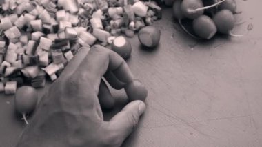 Closeup chef hands chopping organic radish in kitchen
