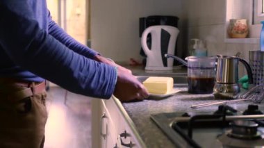 15 seconds man making keto coffee with butter and MCT oil at home 