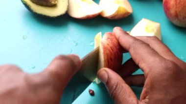 Chef preparing fruits on chopping board for healthy salad