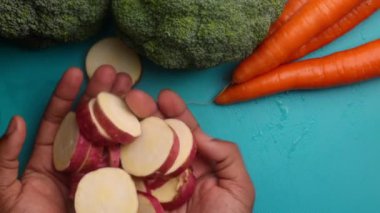 Person hands preparing organic vegetables for healthy meal in kitchen