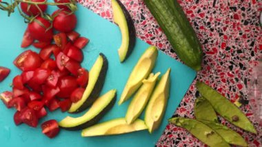 Top view chef making healthy vegetarian salad in kitchen