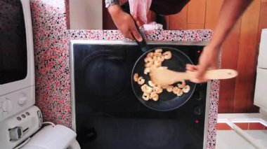  Top view chef preparing shrimps on electric stove