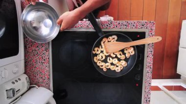  Top view chef preparing shrimps on electric stove